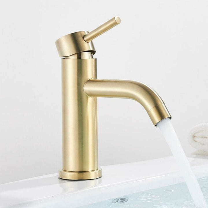 Modern bath tap in brushed gold
