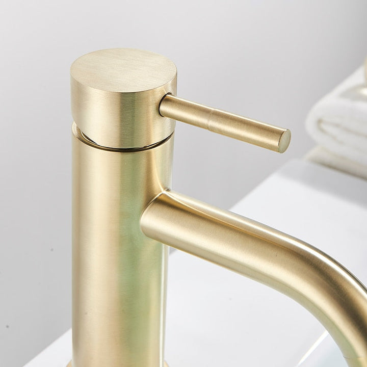 Modern bath tap in brushed gold