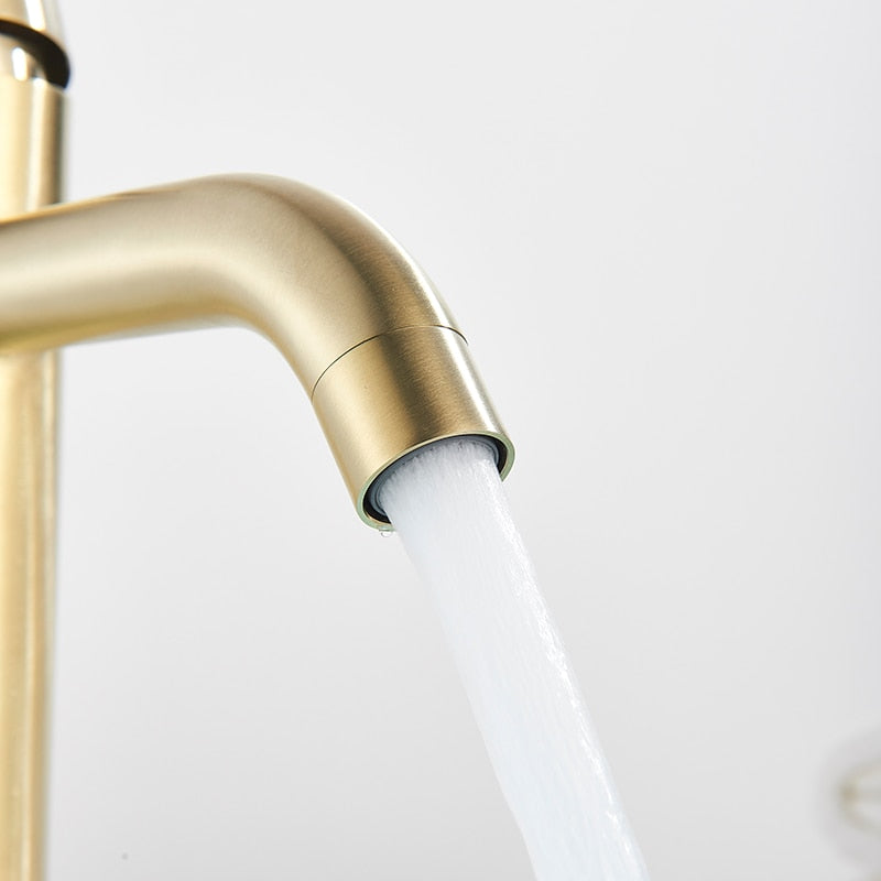 Modern bath tap in brushed gold