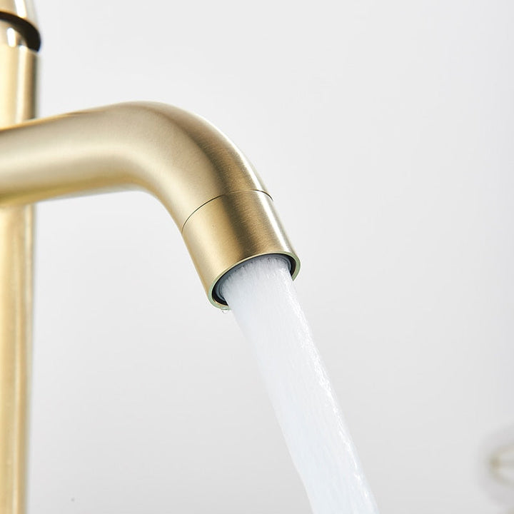 Modern bath tap in brushed gold